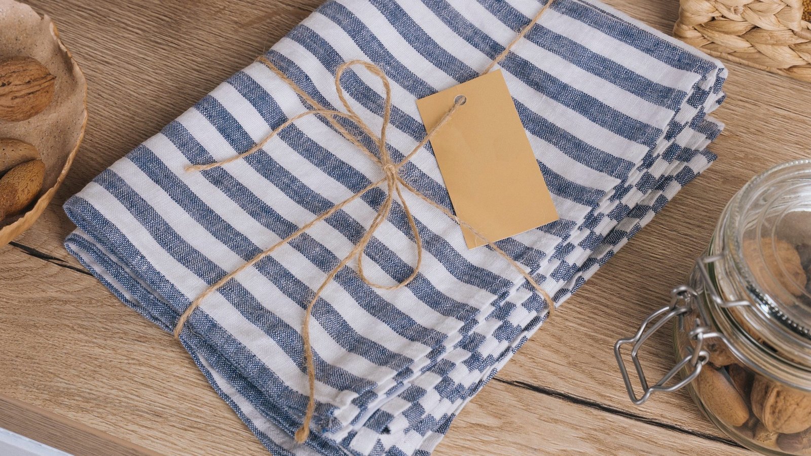 Striped towels folded, tied with twine and tagged, ready to go out on a route